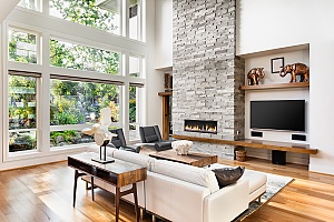 Beautiful,Living,Room,Interior,With,Hardwood,Floors,And,Roaring,Fire