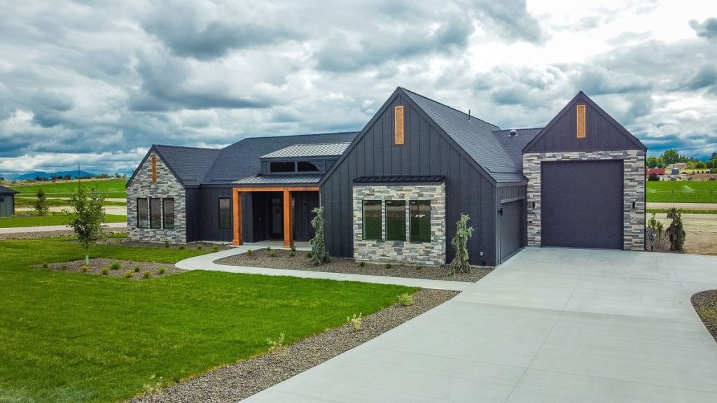 Custom Caldwell Idaho home with an attached RV garage and stone exterior