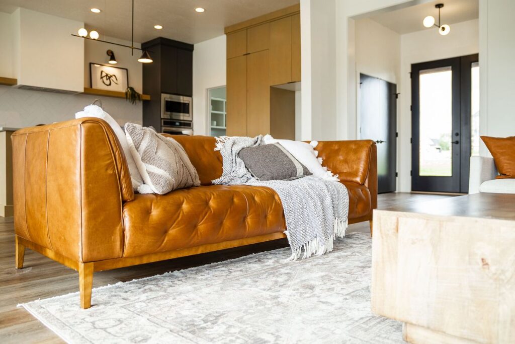 Custom home living room with leather sofa and modern finishes in Emmett, Idaho